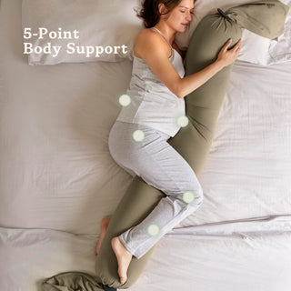 Woman using a bbhugme pregnancy pillow with