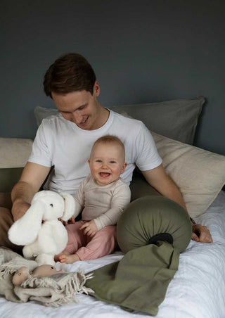 A dad with a happy baby