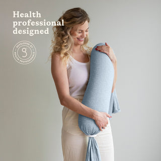 Woman holding a bbhugme nursing pillow with 