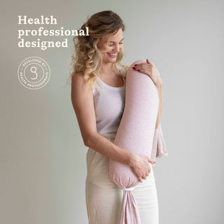 Woman holding a bbhugme nursing pillow with 