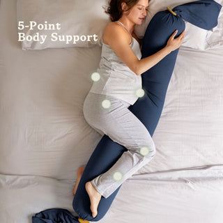 Woman using a bbhugme pregnancy pillow with 