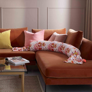 bbhugme pregnancy pillow blushing roses in a living room setting.